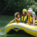 A family on a river rafting tour in Niseko, Hokkaido